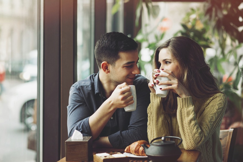 Couple-in-love-drinking-coffee-in-coffee-shop